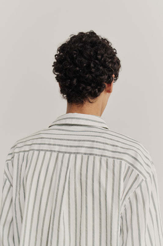 Men's long-sleeved shirt, cotton-silk-linen blend, washed finish, white with subtle green stripes, oversized fit.