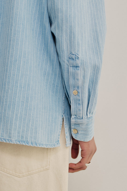 Men's long-sleeved shirt, organic cotton light blue denim with white pinstripes, washed finish, and side slit.