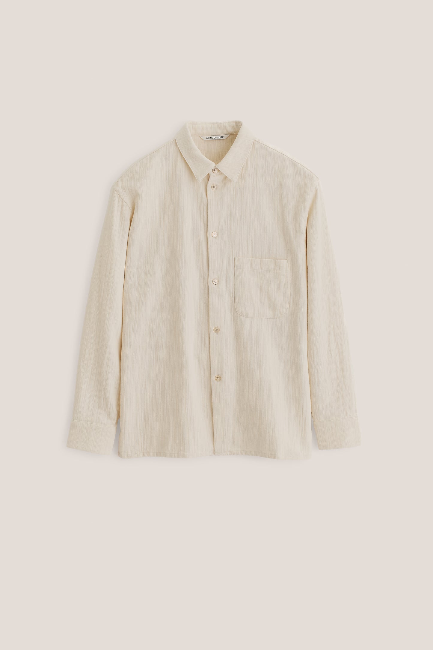 Men's long-sleeved shirt, recycled cotton mix, textured weave, off-white, oversized with patch pocket.