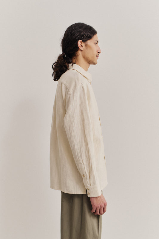 Men's long-sleeved shirt, recycled cotton mix, textured weave, off-white, oversized fit, side slits.