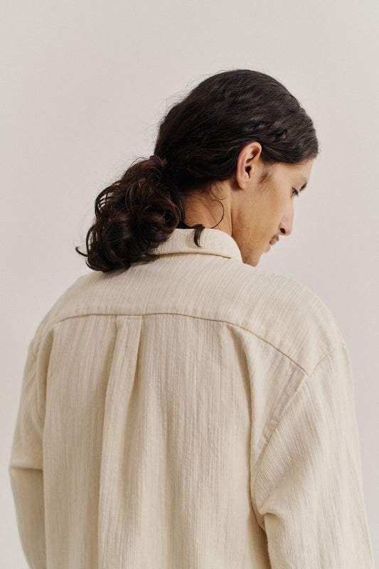Men's long-sleeved shirt, recycled cotton mix, textured weave, natural slubbed effect, beige, oversized fit with back pleat.