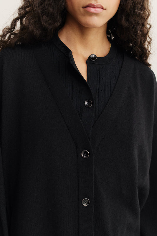 Women's knit cardigan, 100% merino wool, black, with mock underlayer and ajour knit pattern.