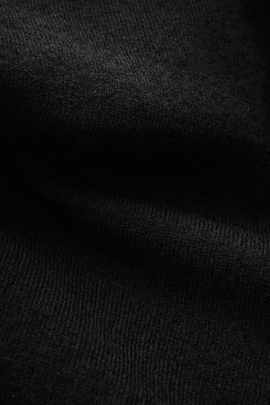 Women's knit cardigan, 100% merino wool, black, with ajour knit pattern and ribbed trim.