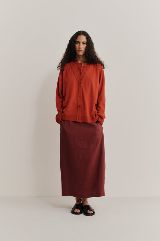 Women's knit cardigan, 100% merino wool, ajour knit, rust, with mock underlayer and dropped shoulders.