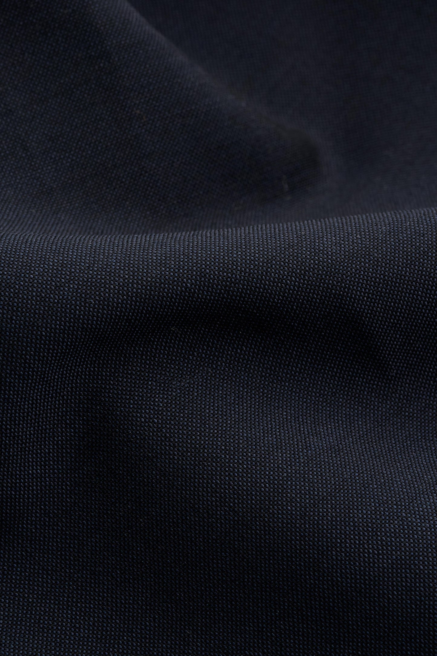 Unisex shorts, dark navy 100% virgin wool, crisp hand feel, single side pleat, slanted pockets.