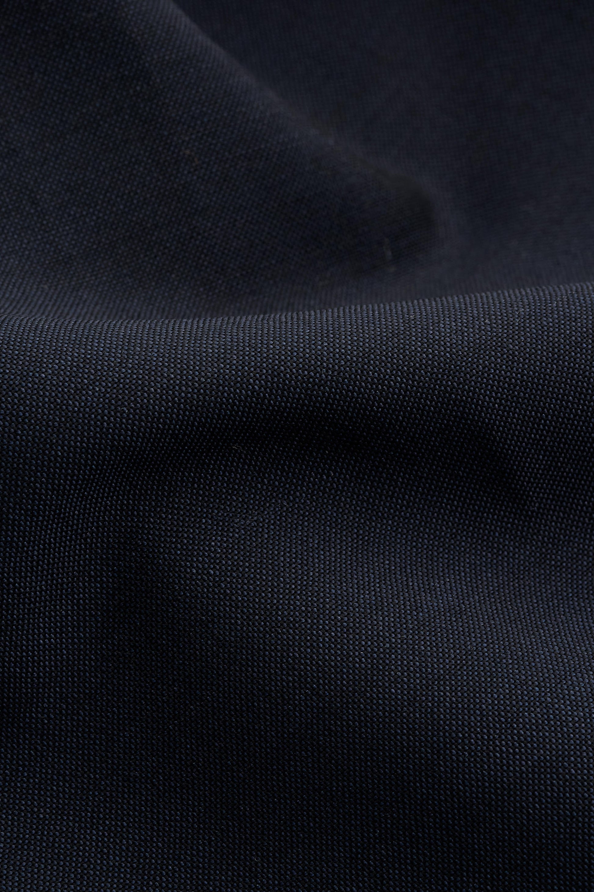Unisex shorts, dark navy 100% virgin wool, crisp hand feel, single side pleat, slanted pockets.