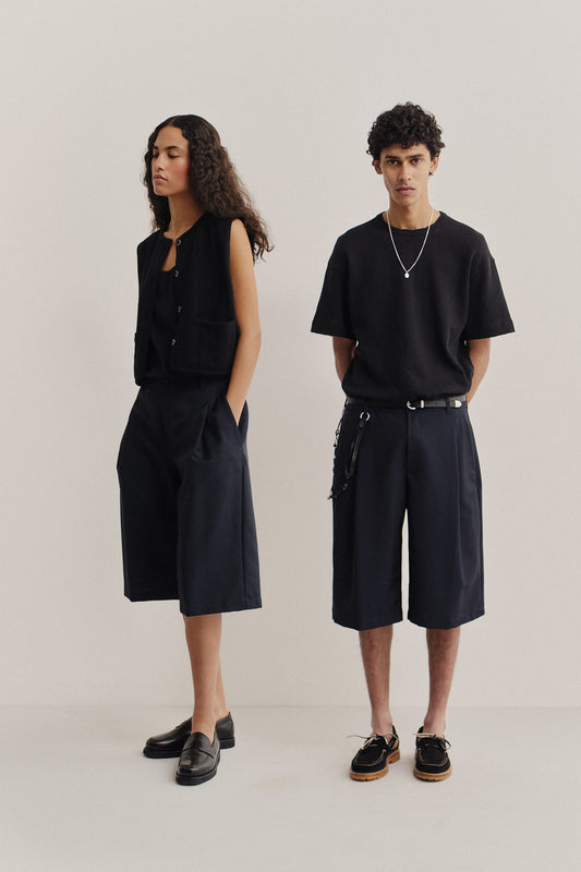 Unisex shorts, 100% virgin wool, dark navy, knee-length, relaxed fit, wide leg, single pleat.