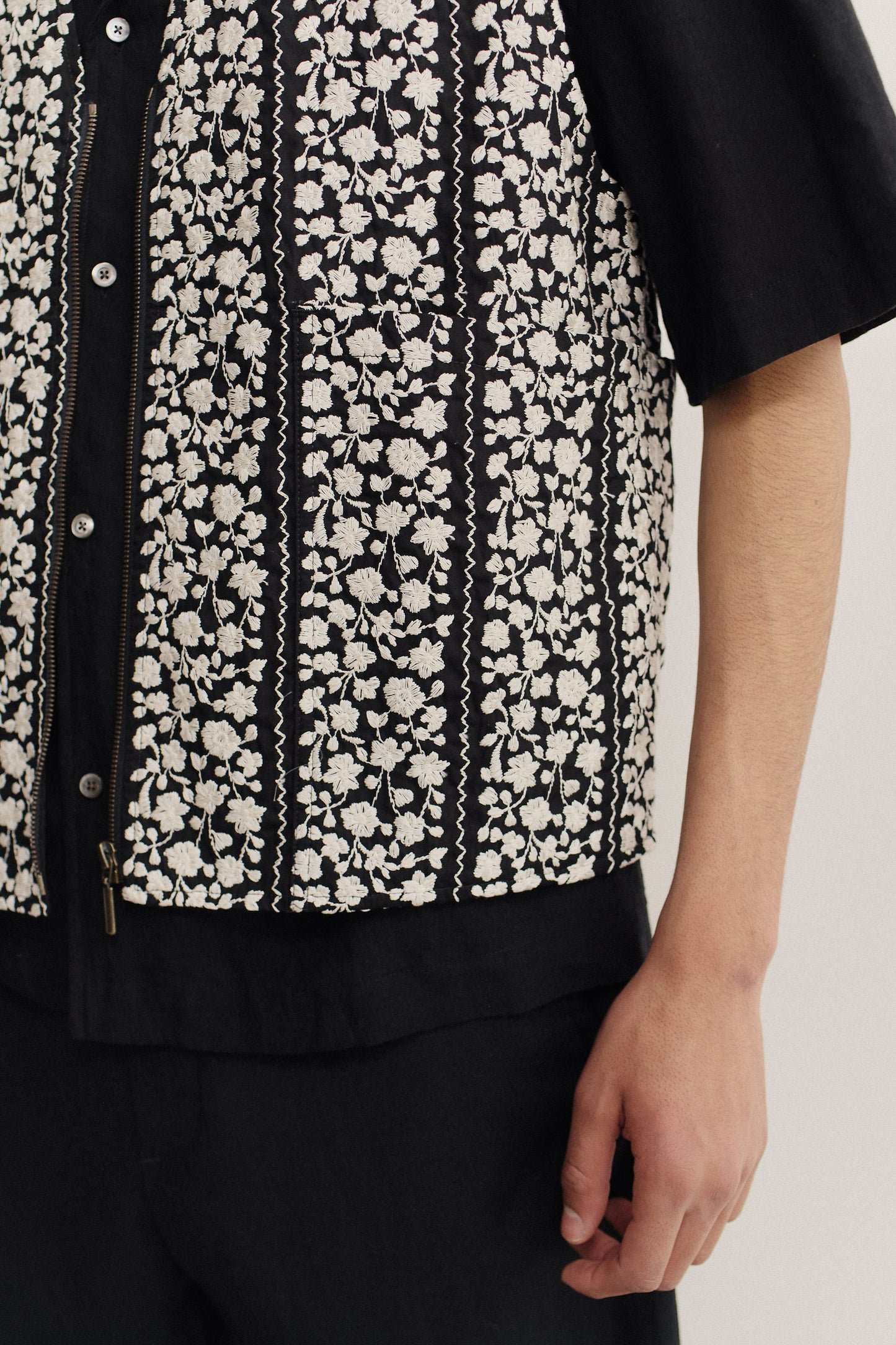 Men's outerwear vest, cotton, black with white embroidered flower blocks, metal zipper.