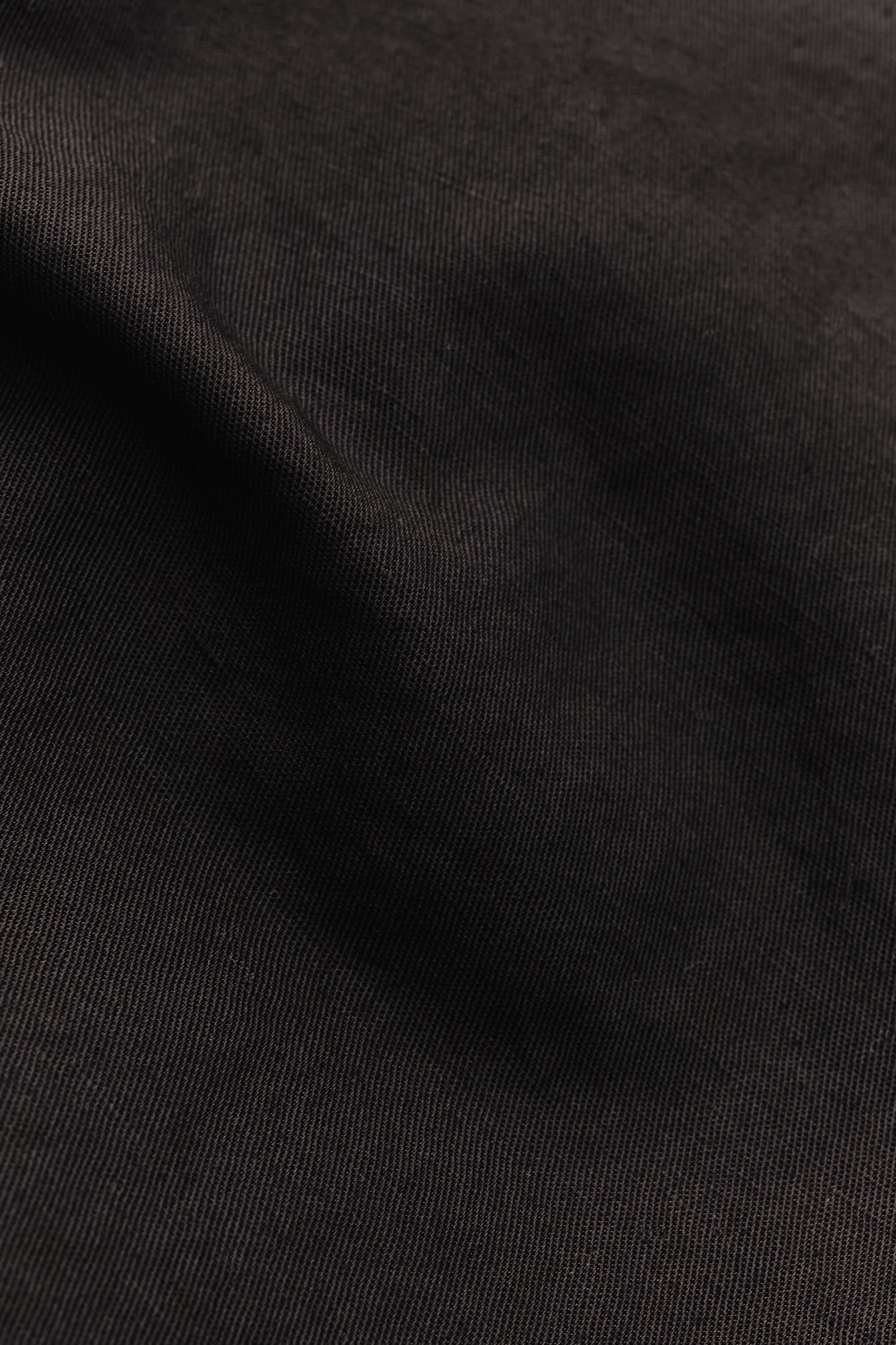 Men's long-pants, linen and cotton blend, garment-dyed deep black, structured weave.