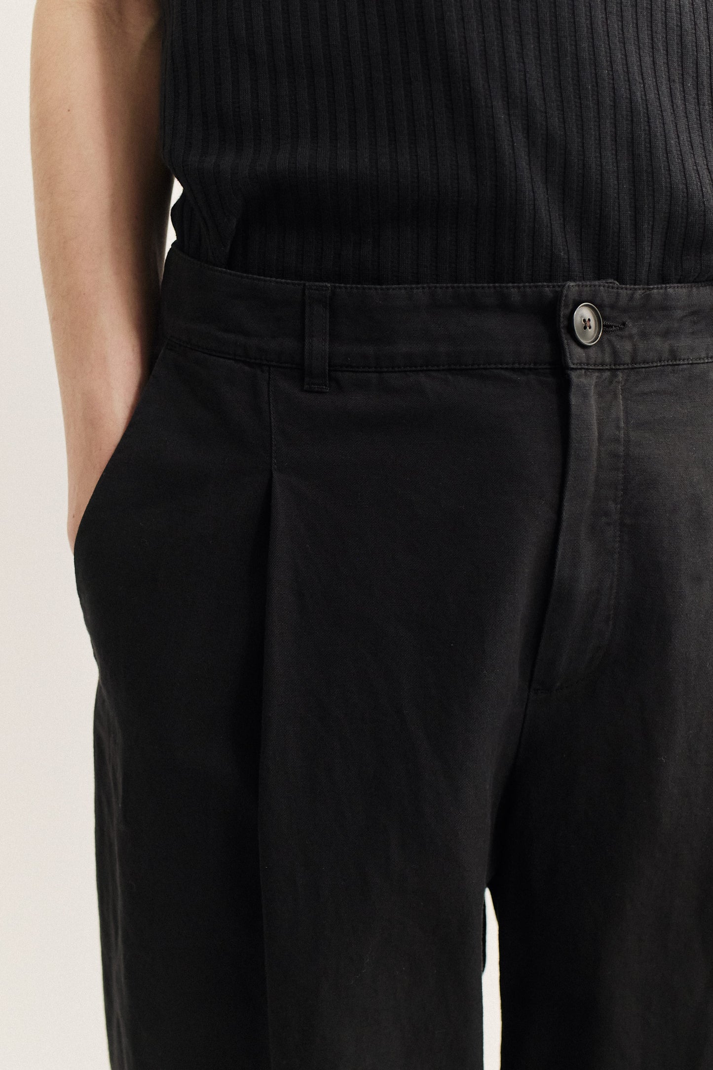 Men's long-pants, linen and cotton blend, garment-dyed black, with single front pleat and belt loops.