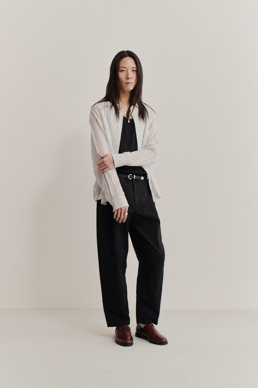 Men's long-pants, linen and cotton blend, garment-dyed black, loose tapered silhouette, cropped leg.