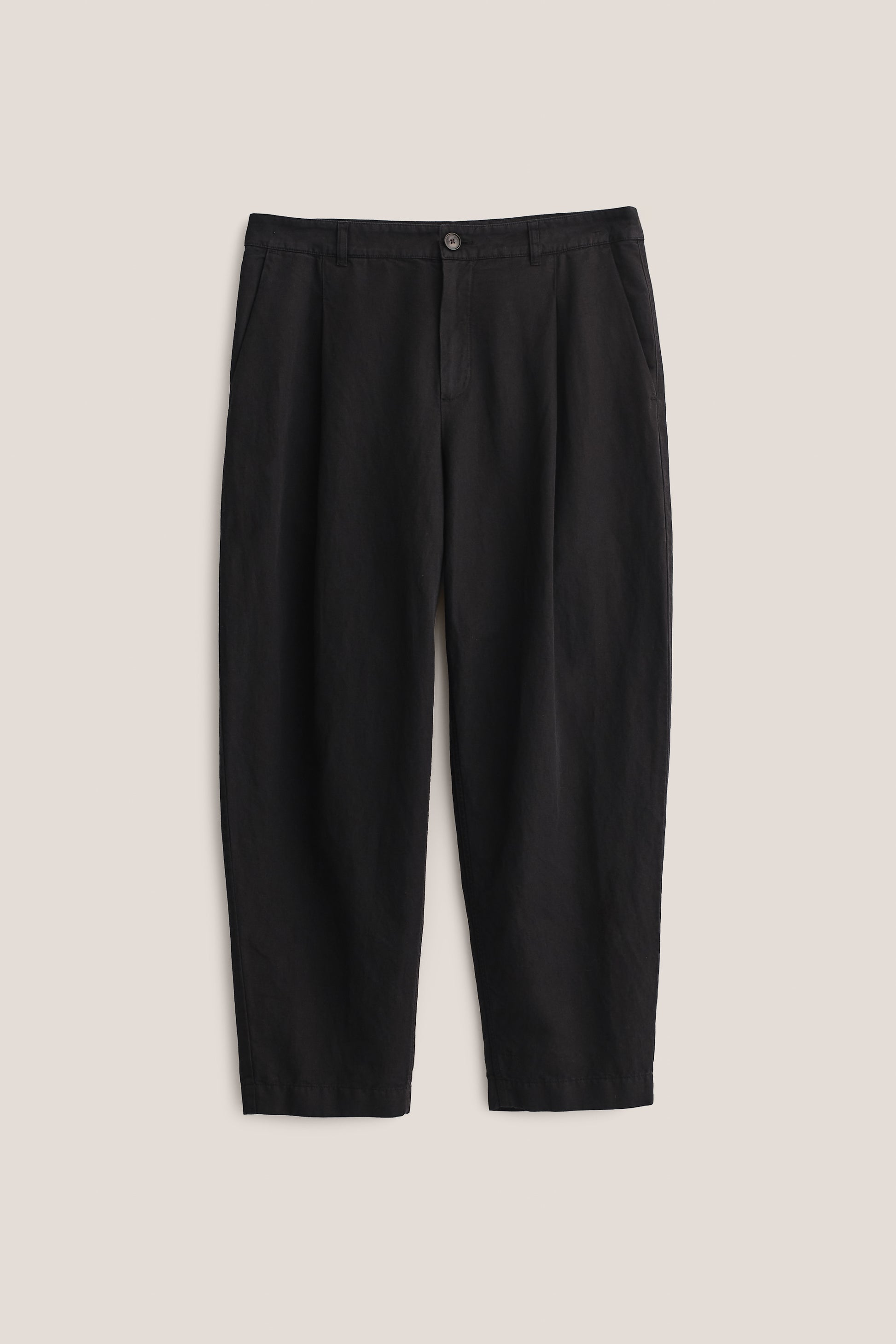Men's long-pants, linen and cotton blend, garment-dyed black, with single front pleat and cropped tapered leg.