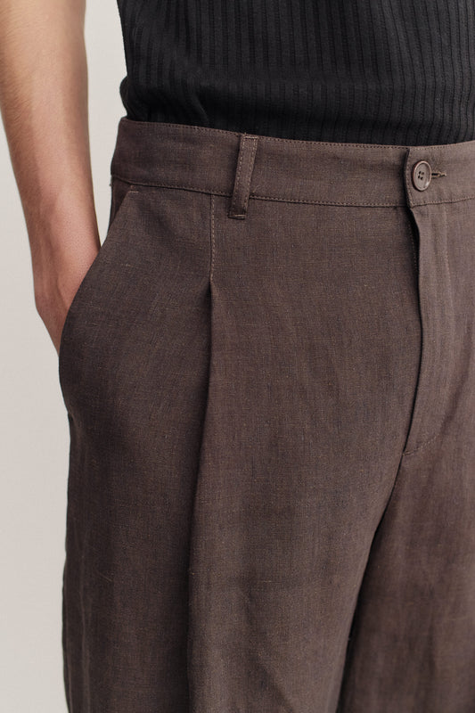 Men's long-pants, 100% linen, canvas weave, brown, with single front pleat and belt loops.
