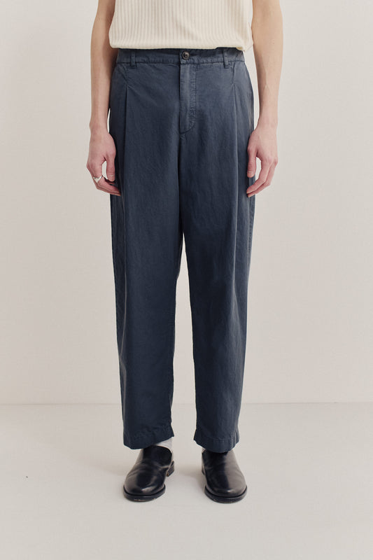 Men's long-pants, cotton-linen blend, garment dyed, navy, with single front pleat and cropped tapered leg.