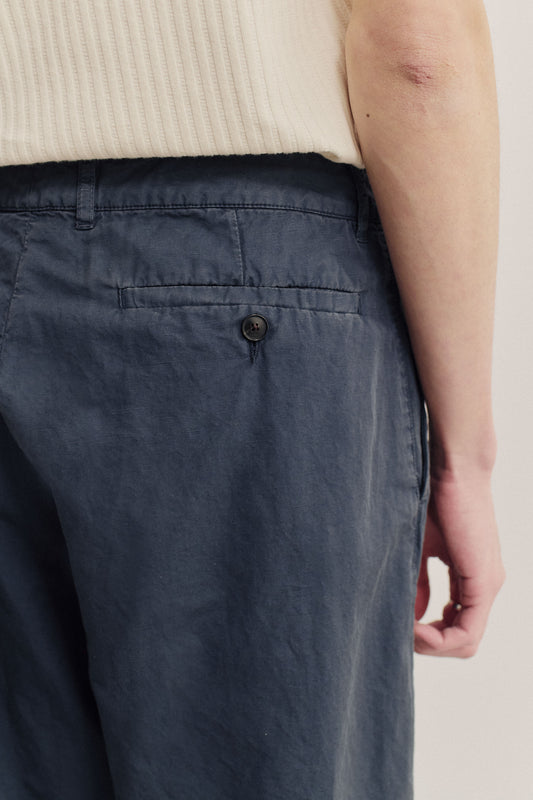 Men's long-pants, cotton-linen blend, garment dyed navy, with single back buttoned pocket.