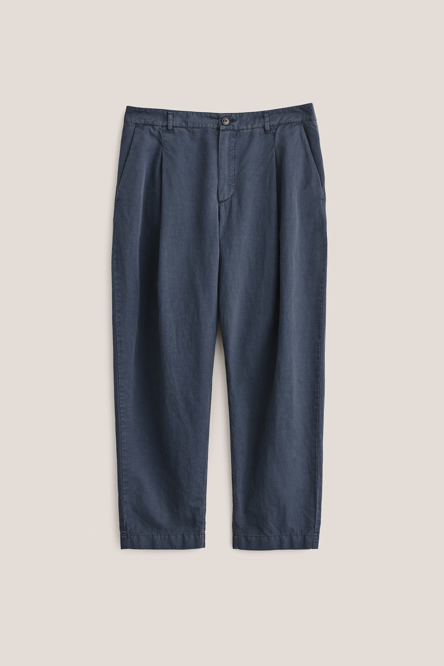 Men's long-pants, cotton-linen blend, garment dyed navy, with single front pleats and cropped tapered leg.