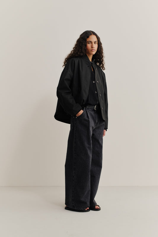 Women's outerwear, black cotton blend Kibera jacket with stand collar and front patch pockets.