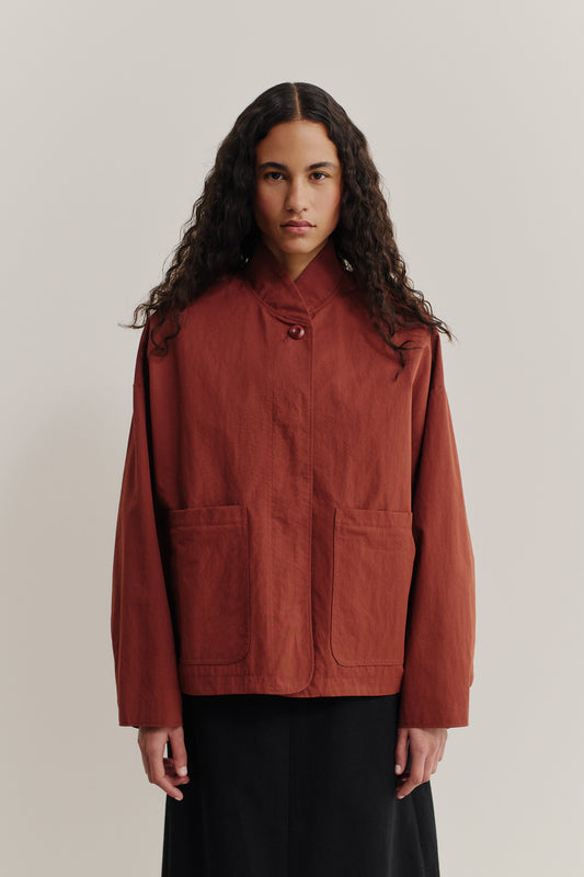 Women's outerwear jacket, water-repellent cotton blend, terracotta, with stand collar and patch pockets.