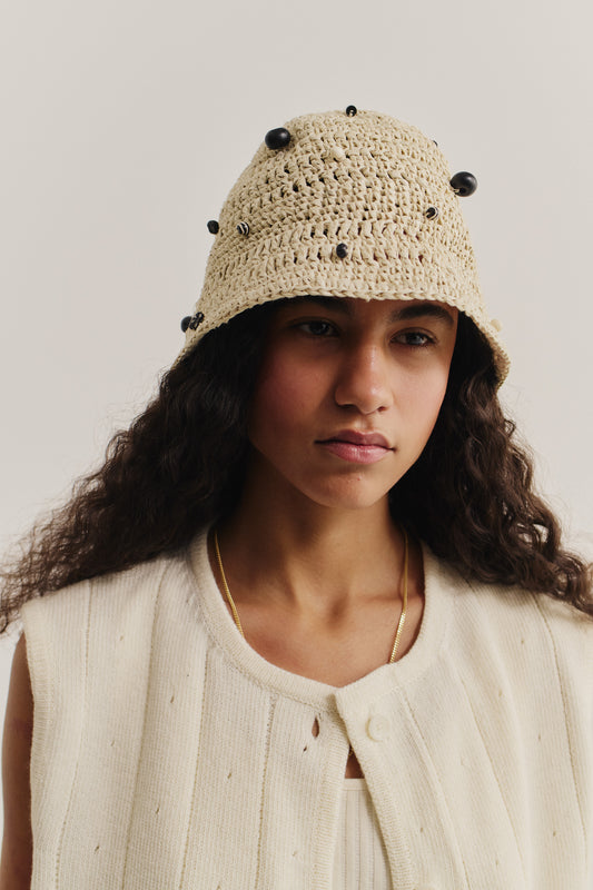 Women's accessories bucket hat, crocheted raffia-look yarn, beige with black beads.