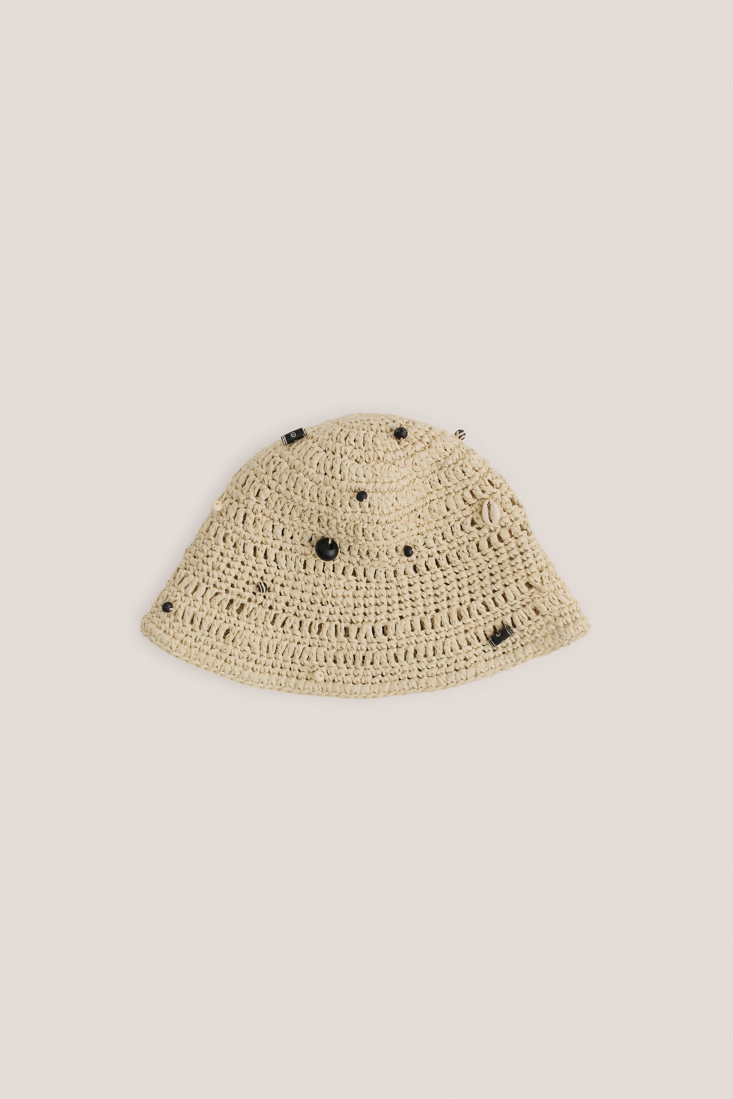 Unisex accessories bucket hat, crocheted Italian viscose-linen blend, natural raffia look, decorated with mussels and wooden beads, light beige.