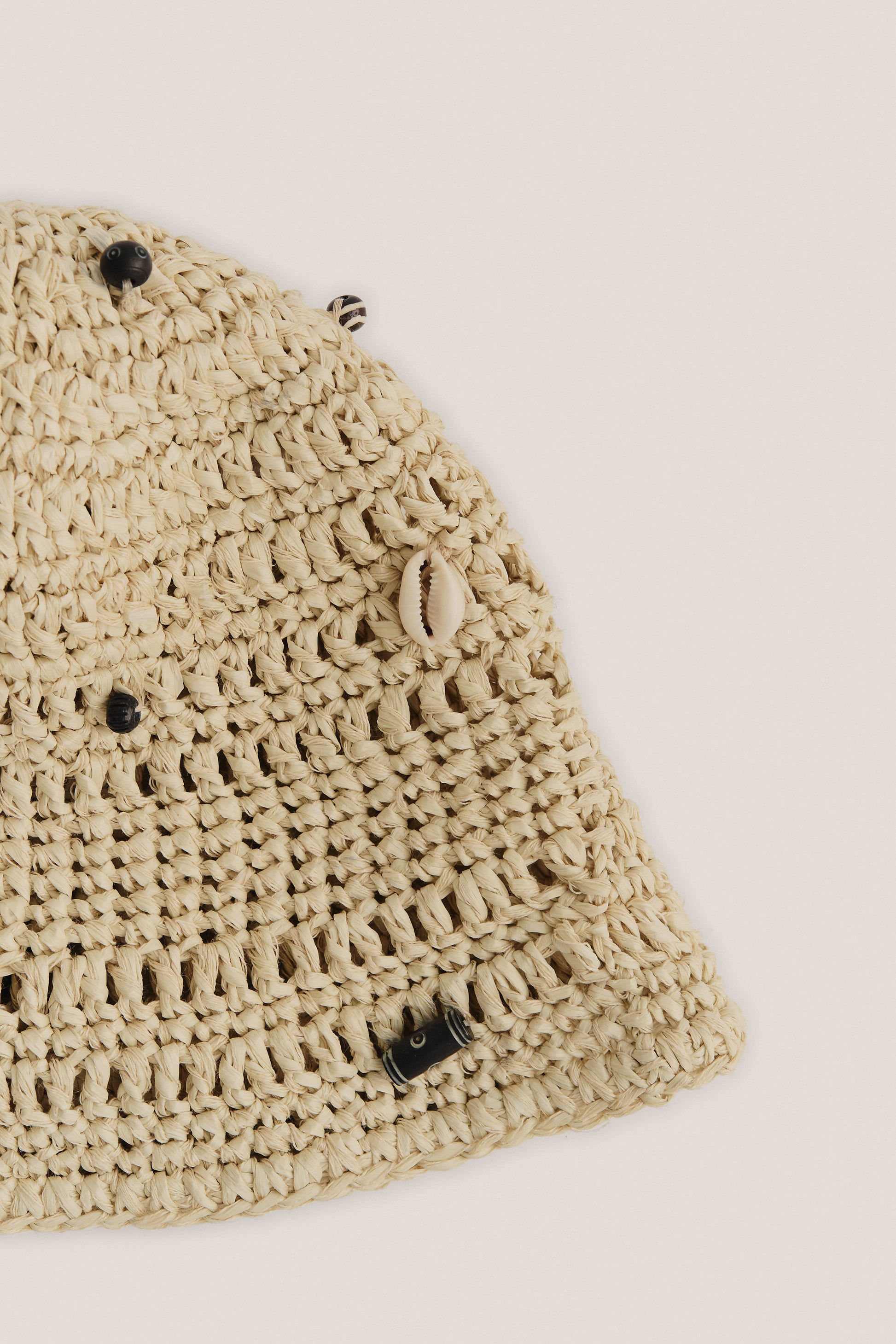 Women's accessories bucket hat, raffia-like viscose-linen-cotton blend, natural beige, with mussels and wooden beads.