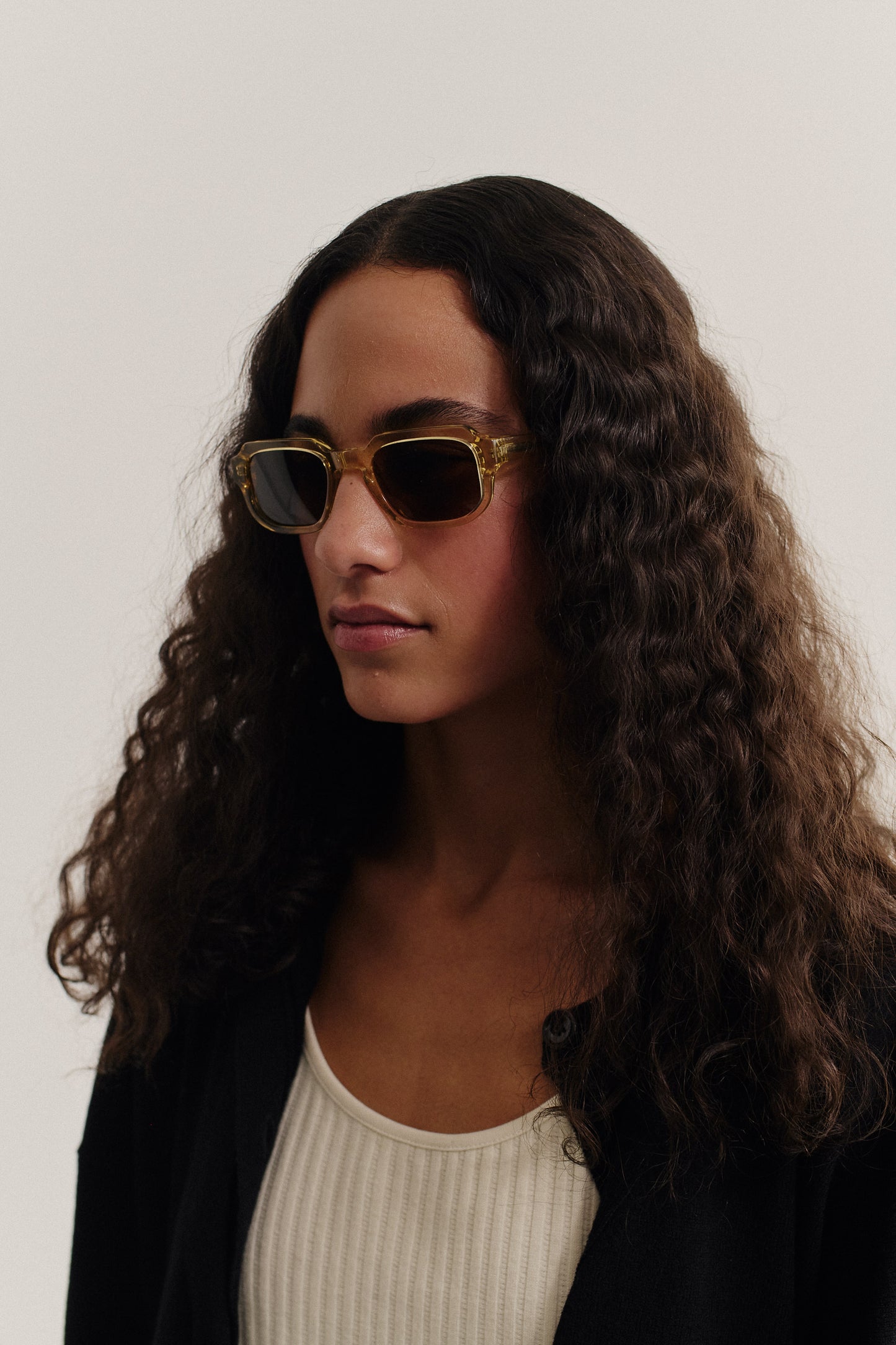 Women's accessories sunglasses, transparent olive acetate, rectangular frame, dark lenses.
