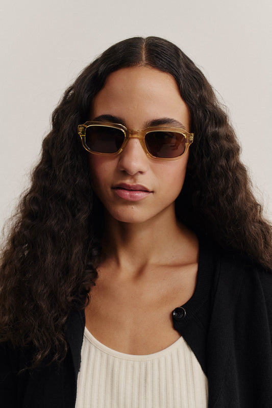 Women's accessories, rectangular acetate sunglasses in translucent olive, featuring dark Carl Zeiss® lenses.