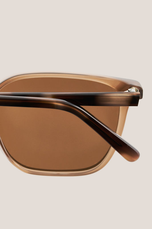 Unisex accessories sunglasses, brown acetate frame with dark brown tortoise temples and brown lenses.