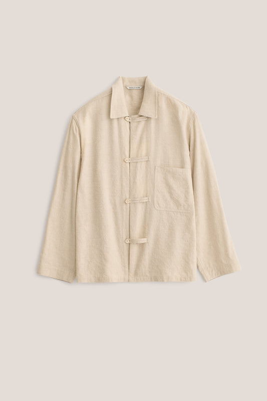 Men's outerwear, long-sleeved overshirt, linen-silk blend, naturally textured, undyed beige, with frog button fastening and patch pocket.