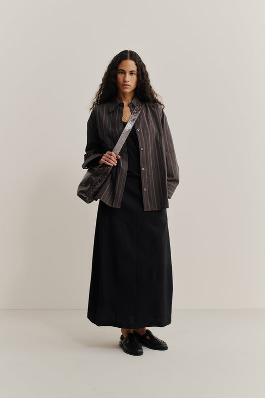 Women's midi skirt, o-shaped, black virgin wool and linen blend, with pockets and back zipper.