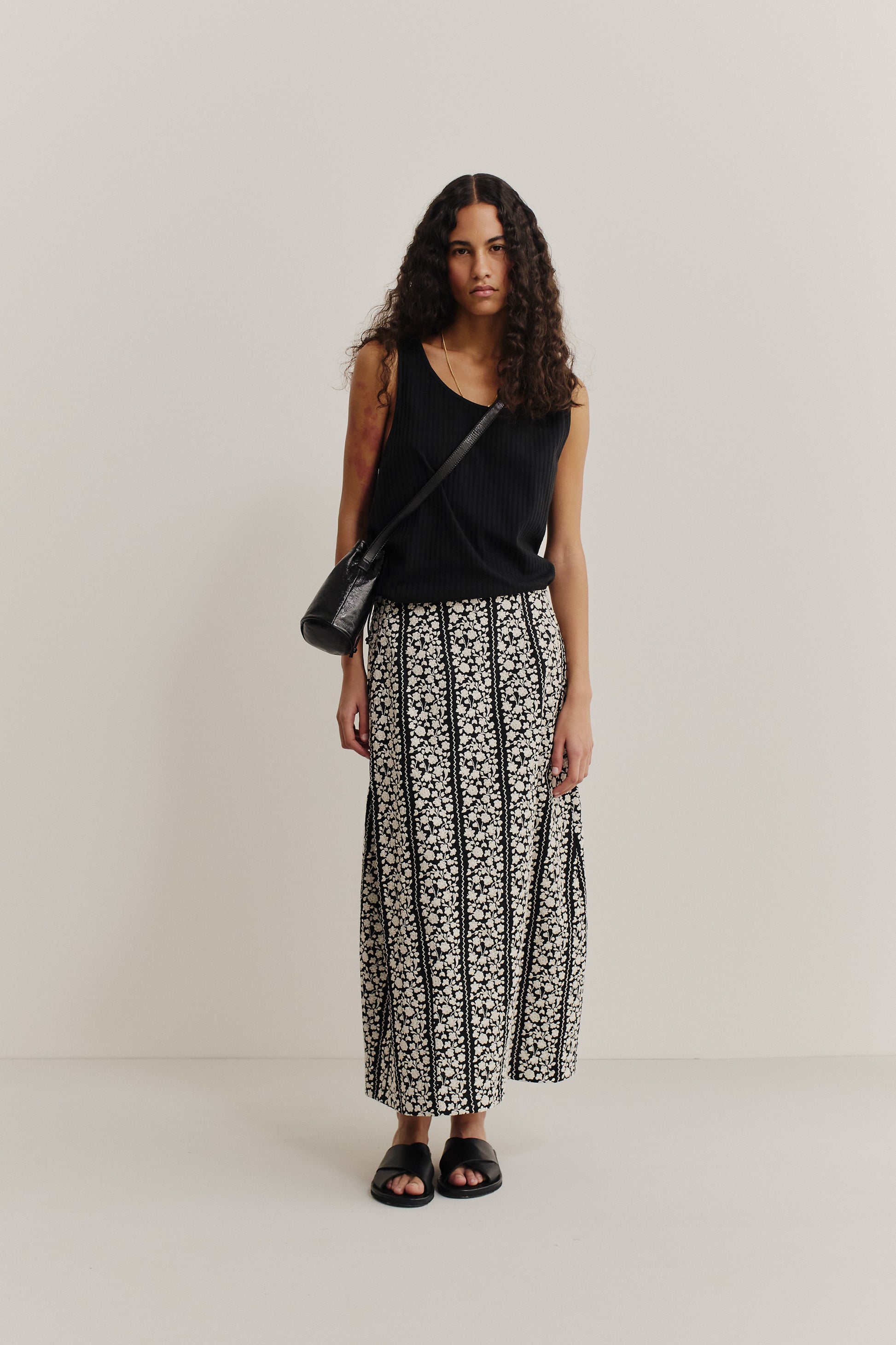 Women's skirt, midi, cotton, black with white embroidered flower blocks, o-shaped fit, side pockets.