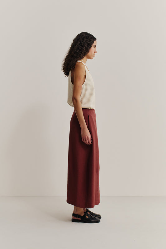 Women's skirt, midi-length, o-shaped silhouette, linen-virgin wool-mohair blend, terracotta, with side pockets.