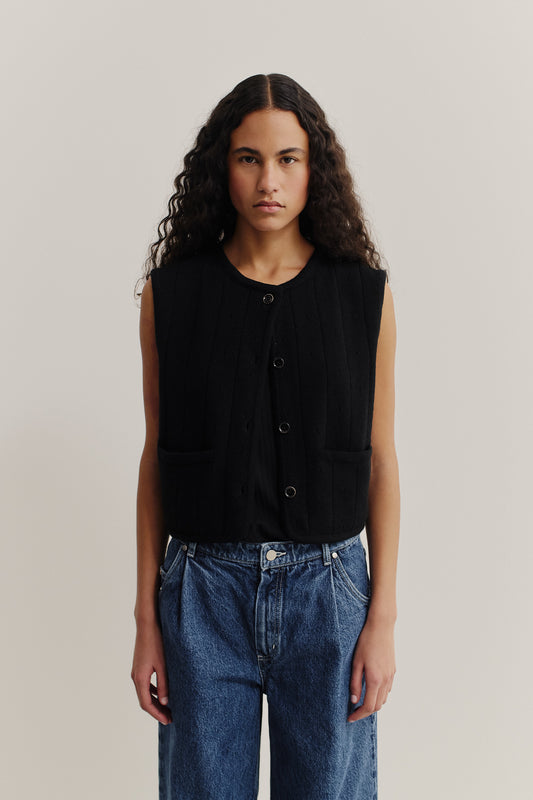 Women's knit vest, 100% merino wool, ajour knit, black, with front buttons and pockets.