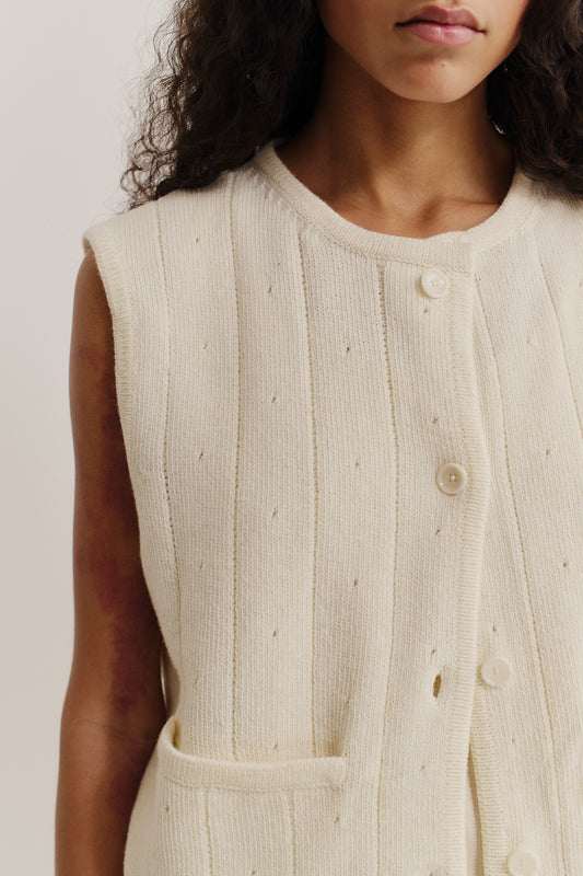 Women's knit vest, 100% merino wool, ajour knit, off-white, with button front and pocket.