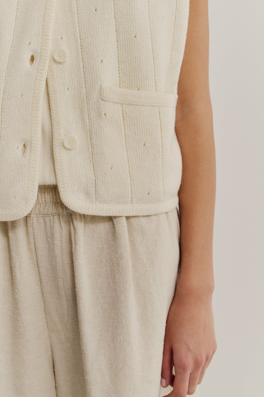 Women's knit vest, 100% merino wool, ajour knit, off-white, with buttons and pocket detail.