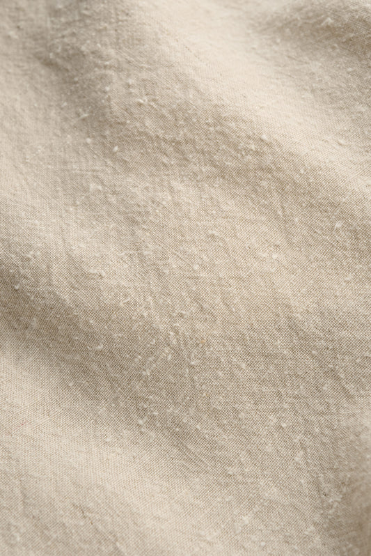 Women's tailoring blazer, linen-silk blend, naturally textured, unbleached mambrui sand fabric.