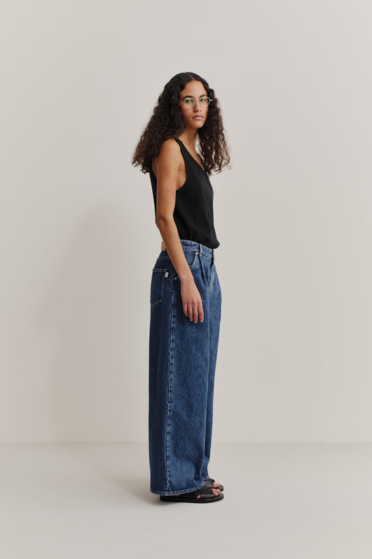 Women's long-pants, recycled cotton denim, stone washed, blue, with pleated wide leg.