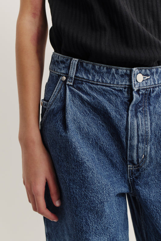Women's long-pants, cotton mix denim, stone washed, blue, with pleat detail and mid-waist fit.