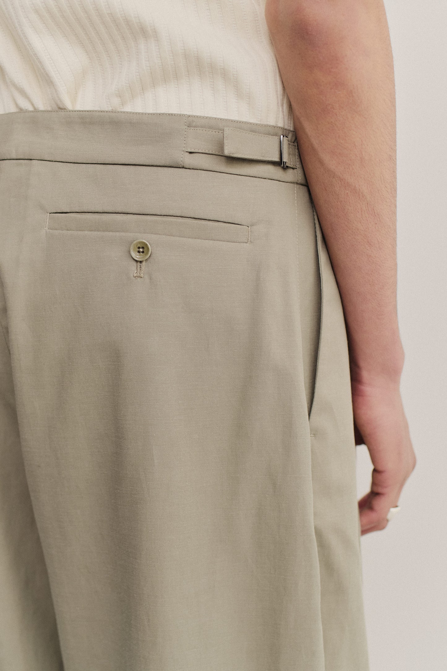 Men's long pants, lyocell-cotton-linen twill, sun-bleached sage, with back welt pocket and adjustable side strap.