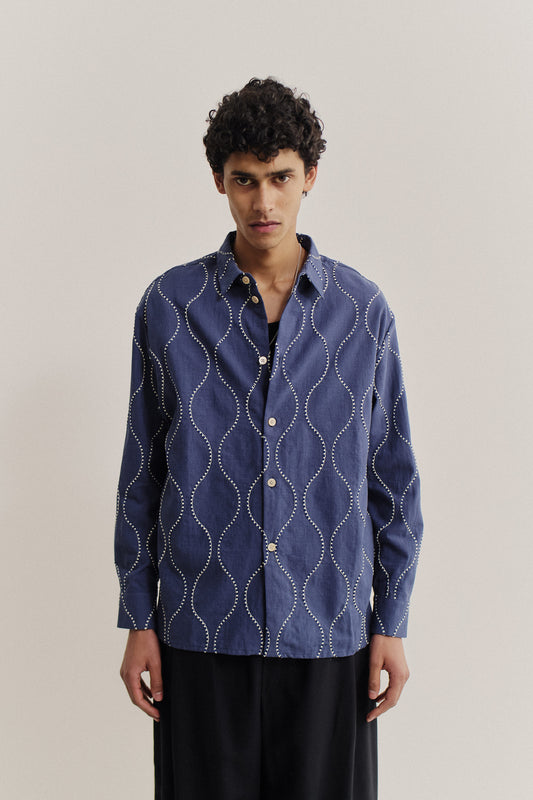 Men's long-sleeved shirt, 100% cotton, soft blue with embroidered wavy navy lines and white contrast stitching.