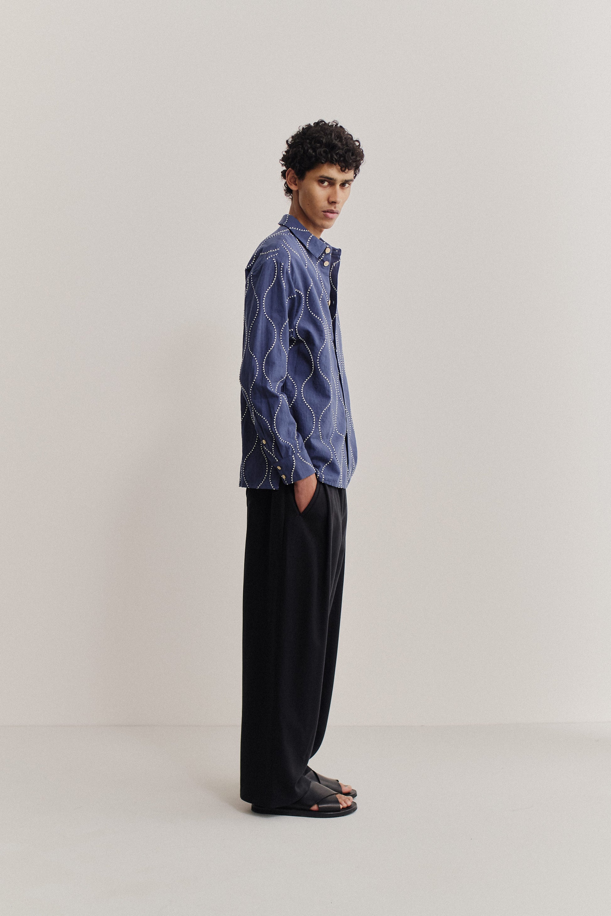 Men's long-sleeved shirt, cotton, embroidered wavy pattern, blue with white stitching.