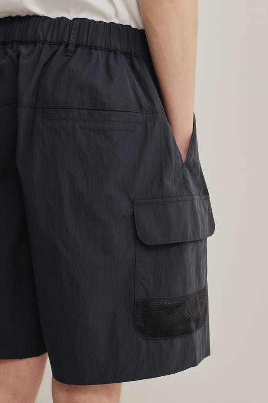 Men's shorts, recycled nylon cotton blend, water-repellent, navy, with side patch pockets and mesh detail.