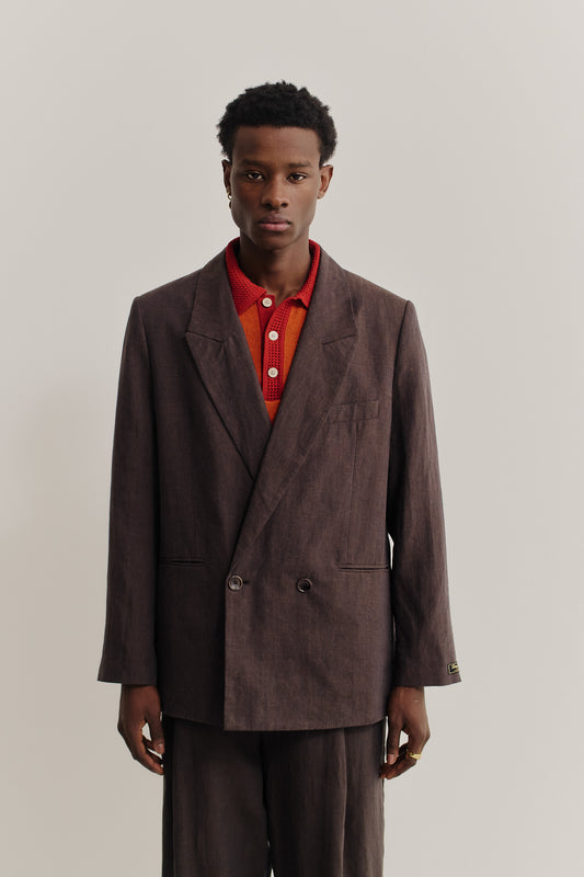Men's tailoring, relaxed double-breasted linen blazer in burnt umber with double back slits.