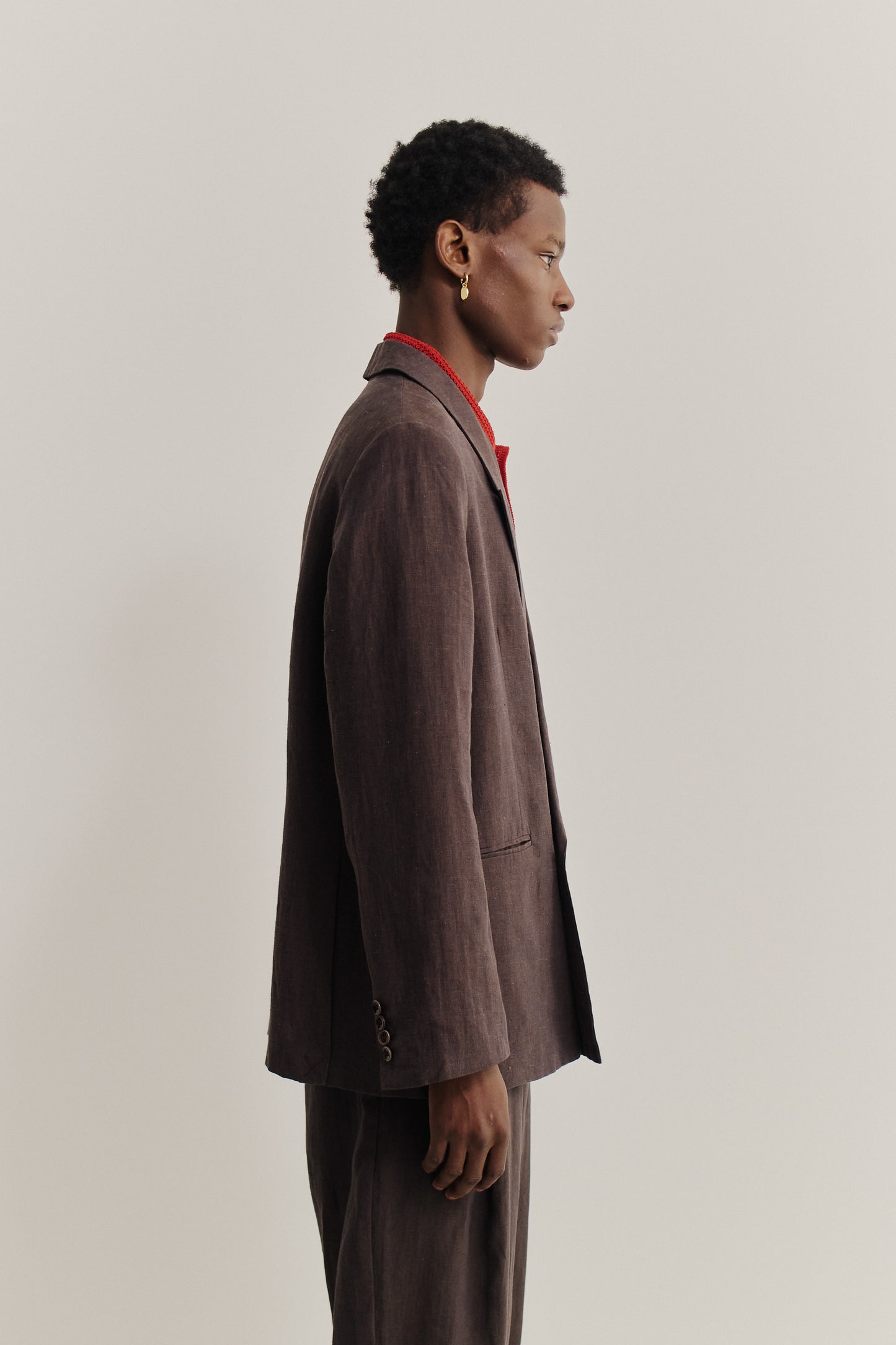 Men's tailoring, double-buttoned blazer, 100% linen, burnt umber, relaxed fit.