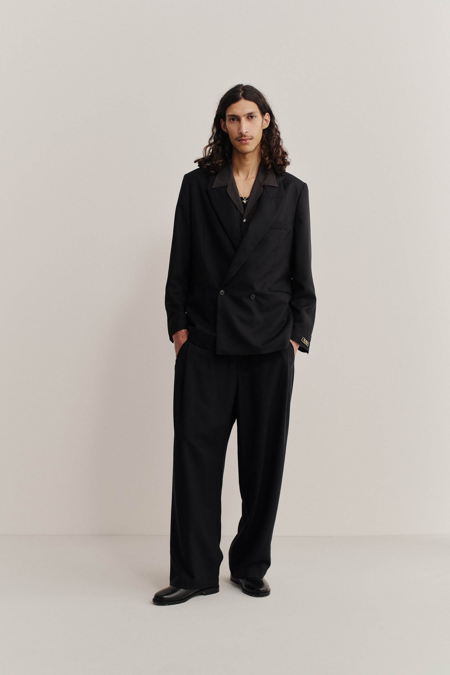 Men's tailoring, double-breasted blazer in black lyocell heavy twill, relaxed fit.