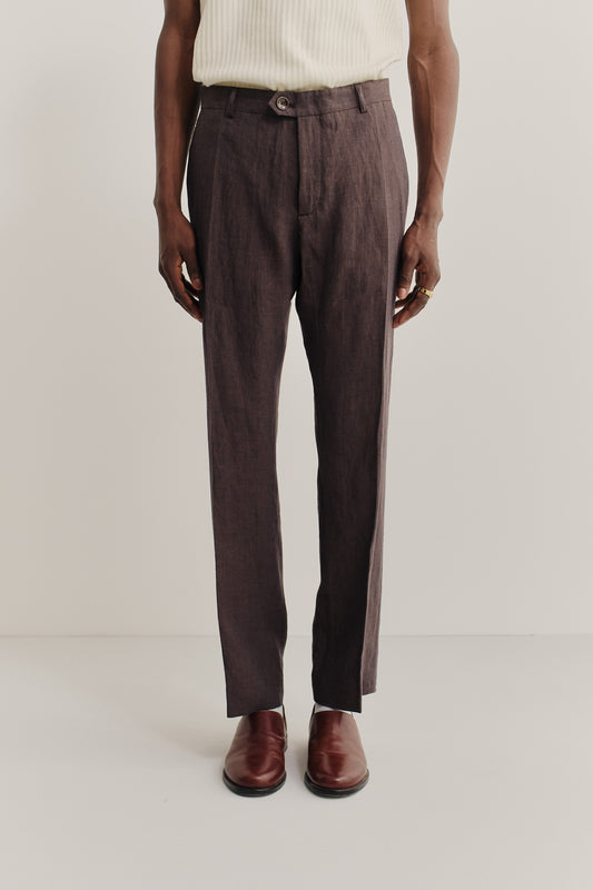 Men's long-pants, 100% linen, classic canvas weave, brown, with front pleats and visible button closure.