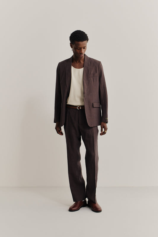 Men's tailoring, long pants, and blazer in brown linen with a subtle, lively surface effect.