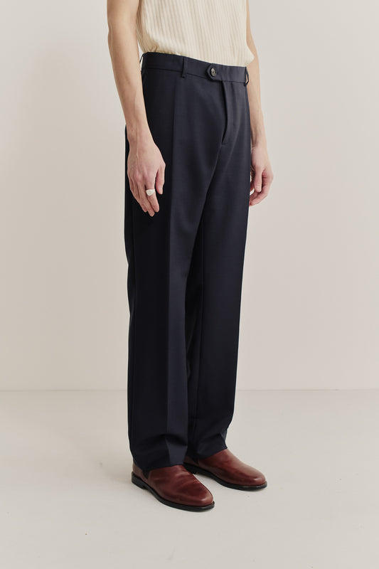 Men's long-pants, 100% virgin wool, dark navy, with a visible front button closure and pleat.