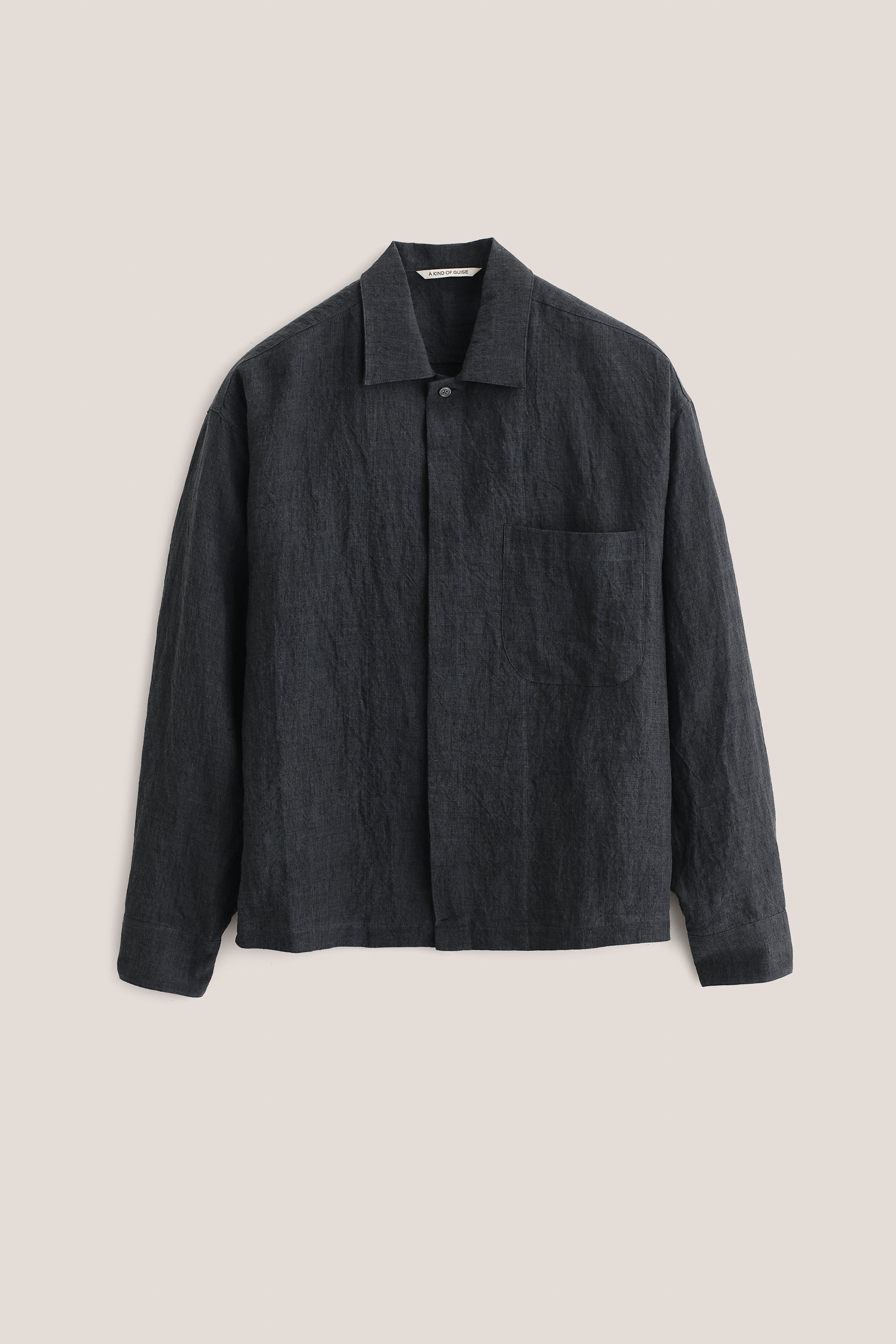Men's long-sleeved shirt, 100% linen, plain weave, vintage-like texture, charcoal, boxy fit, spread collar, patch pocket.