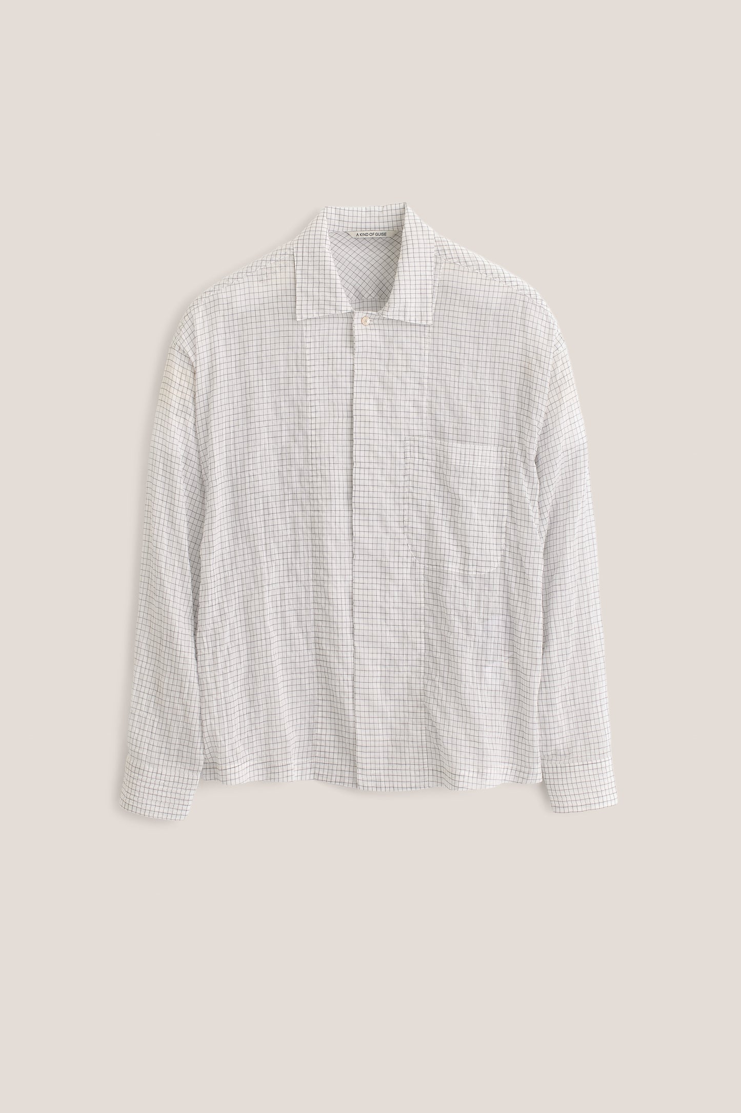 Men's long-sleeved shirt, cotton yarn-dyed check, white, with spread collar, patch pocket, and partially hidden placket.